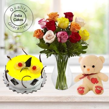 Eggless Pineapple Cake Half Kg with 6 Mix Roses Bunch and a Teddy Bear