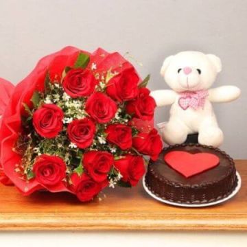 Eggless Chocolate Truffle Cake Half Kg with 6 Red Roses Bunch and a Teddy Bear